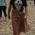 Tim covering his knees with a sarong